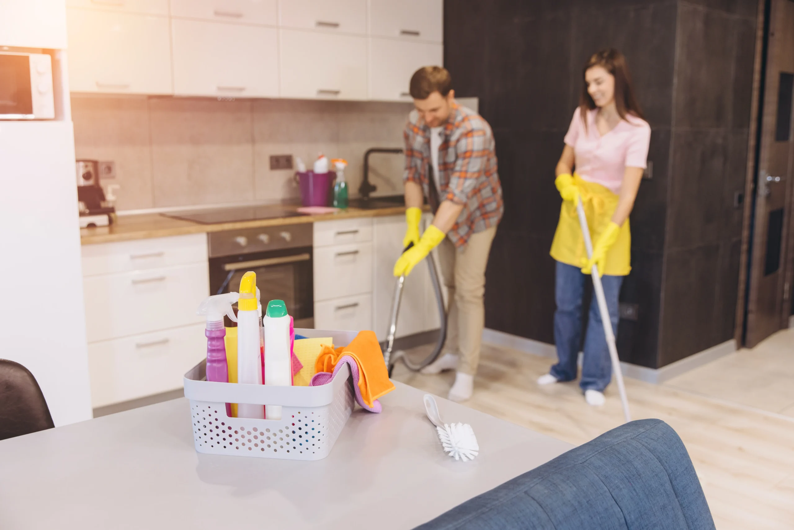 cleaning-products-on-table-with-couple-cleaning-ki-2026-01-09-11-54-03-utc